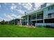 Screened patios enhance this building with a grassy lawn and outdoor seating, great for relaxing outdoors at 1710 Lago Vista Blvd, Palm Harbor, FL 34685