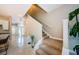 Welcoming home foyer with a staircase, tile floors, and ample natural light at 1710 Lago Vista Blvd, Palm Harbor, FL 34685