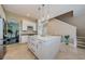 Bright, open kitchen featuring a large center island with white cabinetry and stainless steel appliances, ideal for entertaining at 1710 Lago Vista Blvd, Palm Harbor, FL 34685