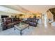 Spacious living room with tile flooring, fireplace, and open concept living and kitchen space at 1710 Lago Vista Blvd, Palm Harbor, FL 34685