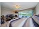 Cozy bedroom offers a serene retreat with waterfront views, fireplace, and a comfortable layout for relaxation and rest at 1710 Lago Vista Blvd, Palm Harbor, FL 34685