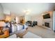 This spacious main bedroom includes a fireplace, large windows, and an office space at 1710 Lago Vista Blvd, Palm Harbor, FL 34685