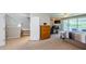 Open bedroom features a sitting area, fireplace, and walk-out balcony at 1710 Lago Vista Blvd, Palm Harbor, FL 34685
