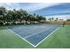 Well-maintained tennis court with secure fencing and convenient parking at 1710 Lago Vista Blvd, Palm Harbor, FL 34685