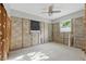 Bright bedroom with a ceiling fan, block walls, and natural light at 1720 Bayou Grande Ne Blvd, St Petersburg, FL 33703