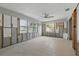 Open living room featuring windows, block walls, and bright lighting at 1720 Bayou Grande Ne Blvd, St Petersburg, FL 33703
