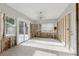 Open living room featuring natural light, sliding glass doors, and block walls at 1720 Bayou Grande Ne Blvd, St Petersburg, FL 33703