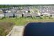 Beautiful aerial view of the community's homes and pond at 17714 Everlong Dr, Land O Lakes, FL 34638