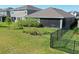 Spacious backyard with a screened-in patio and well-maintained lawn, ideal for outdoor activities at 17714 Everlong Dr, Land O Lakes, FL 34638