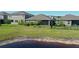 This home features a spacious backyard with a pond view and screened-in porch at 17714 Everlong Dr, Land O Lakes, FL 34638