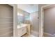 Modern bathroom featuring a glass-enclosed shower, white vanity, and tiled walls, offering a clean and stylish design at 17714 Everlong Dr, Land O Lakes, FL 34638