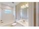 Bathroom with white tiled shower and vanity at 17714 Everlong Dr, Land O Lakes, FL 34638