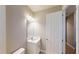 Well-lit bathroom featuring a white vanity with chrome fixtures and a neutral color scheme at 17714 Everlong Dr, Land O Lakes, FL 34638