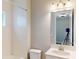 Bright bathroom featuring a tub and shower combination with white tile and modern vanity at 17714 Everlong Dr, Land O Lakes, FL 34638