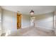 Carpeted bedroom with doors leading to the bathroom and other living areas at 17714 Everlong Dr, Land O Lakes, FL 34638