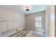 Bright bedroom with neutral paint, carpet, and view to the bathroom at 17714 Everlong Dr, Land O Lakes, FL 34638