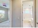 Hallway featuring doors to the bedroom and bathroom at 17714 Everlong Dr, Land O Lakes, FL 34638