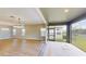 Open living space with access to the patio, providing a seamless indoor-outdoor experience at 17714 Everlong Dr, Land O Lakes, FL 34638