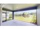 Covered patio offering serene views of the pond and landscaped backyard at 17714 Everlong Dr, Land O Lakes, FL 34638