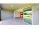 View from the patio showcasing the kitchen and backyard pond through sliding glass doors at 17714 Everlong Dr, Land O Lakes, FL 34638