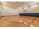 Indoor basketball court with polished wooden floors, hoops, and ample lighting at 1967 Cormorant Ct # 515, Clearwater, FL 33762