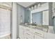 Bathroom featuring white vanity with marble countertop and an updated light fixture at 1967 Cormorant Ct # 515, Clearwater, FL 33762