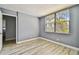 Empty bedroom has laminate flooring and light gray painted walls at 1967 Cormorant Ct # 515, Clearwater, FL 33762