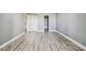 Bedroom featuring hard surface flooring and a double door closet at 1967 Cormorant Ct # 515, Clearwater, FL 33762