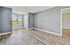 Bedroom featuring hard surface flooring and a large window at 1967 Cormorant Ct # 515, Clearwater, FL 33762