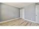 Empty bedroom features light gray walls, and laminate flooring at 1967 Cormorant Ct # 515, Clearwater, FL 33762