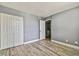 Bedroom with light gray walls, closet, and laminate flooring at 1967 Cormorant Ct # 515, Clearwater, FL 33762