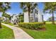 Charming condo building featuring well-maintained landscaping, sidewalks, and ample parking at 1967 Cormorant Ct # 515, Clearwater, FL 33762