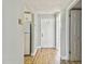Hallway features laminate flooring leading into a kitchen at 1967 Cormorant Ct # 515, Clearwater, FL 33762