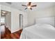 Bright bedroom boasts wood-look floors, neutral walls, ceiling fan, and ample closet space at 2007 Searay Shore Dr, Clearwater, FL 33763