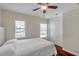 Comfortable bedroom features wood-look floors, natural light, and generous closet space at 2007 Searay Shore Dr, Clearwater, FL 33763