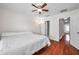 Bedroom with wood floors, ceiling fan, and neutral paint color at 2007 Searay Shore Dr, Clearwater, FL 33763