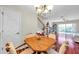 Inviting dining room showcasing a wooden table set, chandelier lighting, and stairway to second level at 2007 Searay Shore Dr, Clearwater, FL 33763