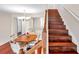 Dining room with wood table and staircase with wood steps at 2007 Searay Shore Dr, Clearwater, FL 33763