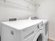 Laundry room with a modern white LG washer and dryer at 2007 Searay Shore Dr, Clearwater, FL 33763