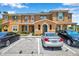 Charming townhomes with assigned parking, colorful exteriors, and well-maintained landscaping in a vibrant community at 2007 Searay Shore Dr, Clearwater, FL 33763