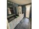 A contemporary bathroom with granite countertops, tiled floors, and an enclosed glass block window at 2043 Sugarbush Dr, Holiday, FL 34690