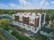 Bird's-eye view of modern townhouses with a black and white design nestled in lush greenery near a quiet street at 2120 4Th S St, St Petersburg, FL 33705