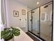 Sleek bathroom featuring a frameless glass shower, marble tile, and modern fixtures at 2120 4Th S St, St Petersburg, FL 33705