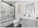 Modern bathroom features white marble shower, sleek vanity, illuminated mirror, and contemporary fixtures at 2120 4Th S St, St Petersburg, FL 33705