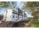 Modern townhouse showcasing sleek lines and contrasting colors, complemented by well-defined entry stairs at 2120 4Th S St, St Petersburg, FL 33705
