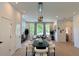 Inviting open floor plan featuring a dining area, modern lighting, and a living room perfect for gathering at 2120 4Th S St, St Petersburg, FL 33705