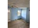 Bedroom featuring wood flooring, light blue walls, a window and ceiling fan at 2414 S 67Th St, Tampa, FL 33619