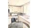 Bright kitchen featuring a double sink, white cabinets, and a range at 2414 S 67Th St, Tampa, FL 33619
