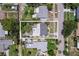 Aerial view of a single-Gathering home showcasing its location and surrounding neighborhood with mature trees at 257 43Rd Ave, St Pete Beach, FL 33706