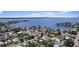 Stunning aerial view displaying the property situated near a serene lake and lush surroundings at 257 43Rd Ave, St Pete Beach, FL 33706